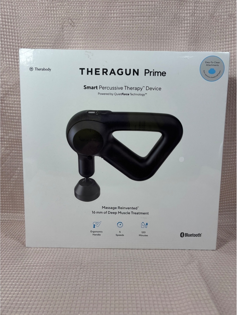 Therabody Theragun Prime, which is a smart percussive therapy device